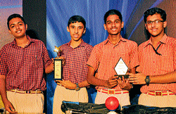 The winners at the IT&#8200;Rural Quiz organised by Public Education department and Tata Consultancy Services, in Mysore on Thursday seen (from left) Udupi district Brahmavaras Little Rock Indian School students Abhishek Rao and Swastik Udupa (State-level), Udupi St Marys English Medium Schools Sandeep Rao andKashmik Kalmadi (divisional-level winners). dh photo