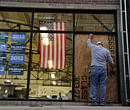 A glass window being replaced at Obama for America headquarters near 9th Avenue and Acoma Street in Denver on Friday, Oct. 12, 2012. Denver police say someone has fired a shot through the window of President Barack Obama's Denver campaign office. AP