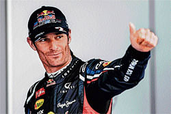 leading the charge: Mark&#8200;Webber gestures after capturing pole position in the Korean GP on Saturday. AFP