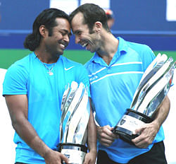 India's Leander Paes (L) and Radek Stepanek of the Czech Republic pose with their trophies after winning the men's doubles final against India's Mahesh Bhupathi and Rohan Bopanna at the Shanghai Masters tennis tournament October 14, 2012. REUTERS