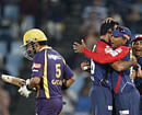 Delhi Daredevils's bowler Irfan Pathan, second from left, celebrates with teammates after dismissing Kolkata Knight Riders's captain Gautam Gambhir, left, during the Champions League Twenty20 cricket match at the Centurion Park in Pretoria, South Africa, Saturday, Oct. 13, 2012. AP