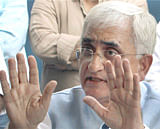 Union Law Minister Salman Khurshid gestures during a press conference in New Delhi on Sunday. PTI