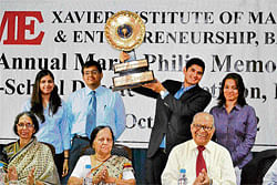proud moment (Back row, with the trophy) Students of T A Pai Management Institute and  runners-up IIM-Bangalore (left), with the dignitaries.