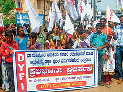 DYFI district committee President Muneer Katipalla demands reconstruction of Lady Goschen Hospital at a protest outside the hospital premises in Mangalore on Monday.