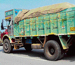 Crime and control: A sand-laden truck proceeds towards Bangalore on National Highway-4.