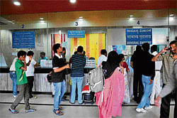 long wait People queuing up at the City Railway Station ticket counters. DH Photos M S Manjunath