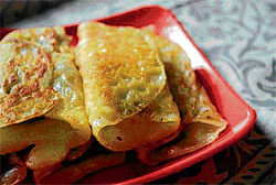 gooey rolls Patishapta, made of rice flour is stuffed with grated coconut and khoya.