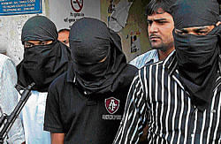 Three suspected Indian Mujahideen terrorists being produced in Tis Hazari Court on Wednesday. PTI Photo