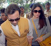Newly-wed couple Saif Ali Khan and Kareena Kapoor arrive at the aiport in Mumbai to fly out for their wedding reception in New Delhi on Thursday. PTI Photo