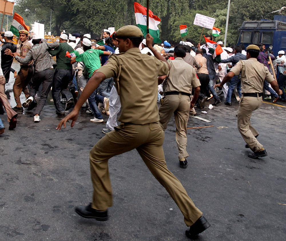 Police lathi charge India Against Corruption activists during a protest in front of Haryana Chief Minister Bhupinder Singh Hooda's residence in New Delhi on Sunday. PTI Photo