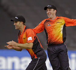 Perth Scorchers Simon Katich, left, celebrates during a Champions League Twenty20. AP Photo