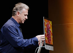 Apple Senior Vice President of Worldwide product marketing Phil Schiller announces the new iMac during an Apple special event at the historic California Theater on October 23, 2012 in San Jose, California. Apple introduced the new iPad mini at the event, Apple's smaller 7.9 inch version of the iPad tablet. AFP