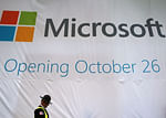 A security officer walks past the soon-to-be-unveiled Microsoft store in Times Square on October 25, 2012 in New York City. AFP