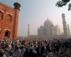 Muslims offer prayers during Eid al-Adha at the historic Taj Mahal in the northern Indian city of Agra October 27, 2012. Muslims around the world celebrate Eid al-Adha, marking the end of the haj, by slaughtering sheep, goats, cows and camels to commemorate Prophet Abraham's willingness to sacrifice his son Ismail on God's command. REUTERS
