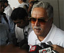 Force India team principal Vijay Mallya talks to the media in the paddock during the third practice session of the Indian F1 Grand Prix at the Buddh International Circuit in Greater Noida. Reuters