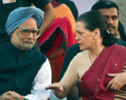 Chairperson of the United Progressive Alliance (UPA) Government Sonia Gandhi (R) gestures while talking with Indian Prime Minister Manmohan Singh. AFP