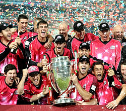 Sydney Sixers's squad celebrates their victory over the Highveld Lions on October 28, 2012 during the final Champions League T20 (CLT20) match at the Wanderers Stadium in Johannesburg. AFP PHOTO