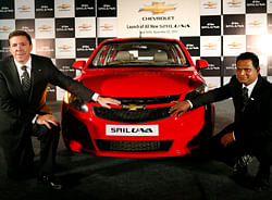 Lowell Paddock, president and managing director of General Motors India, left, and Ashwini Muppasani, vice president for marketing and after sales of General Motors India, pose with a Chevrolet Sail U-VA hatchback at its India launch in New Delhi, India, Friday, Nov. 2, 2012. The car will be available in both gasoline and diesel variant. (AP Photo/Saurabh Das)