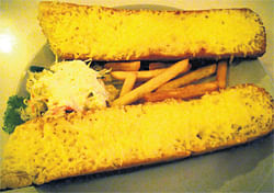 mouth-watering Cheese garlic bread with fries.