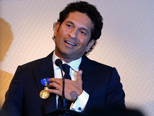 Sachin Tendulkar speaks after being conferred with the membership of The Order of Australia by Simon Crean, Australian Minister for Regional Australia, Regional Development and Local Government, during a ceremony in Mumbai on November 6, 2012. India's record-breaking batsman Sachin Tendulkar on November 6 was conferred with membership of the Order of Australia. Australian Prime Minister Julia Gillard, who announced Tendulkar's membership to the Order during a three-day state visit to India last month, told reporters that Tendulkar deserved the 'special honour' because he was a 'very special cricketer'. AFP