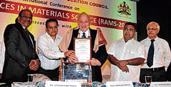 honours: Nobel laureate Prof Rudolph Marcus being felicitated at the international  conference on Recent Advances in Materials Science organised by the Karnataka State Higher  Education Council in Bangalore on Tuesday. (From left) Brahmos Aerospace CEO and MD  Sivathanu Pillai and Tumkur University Vice Chancellor S C Sharma are with him. dh Photo