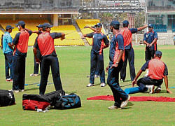 geared up: Karnataka players warm up during a training session at the MA Chidambaram stadium on Thursday.