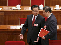 China's President Hu Jintao talks to Vice President Xi Jinping after the closing ceremony of the National People's Congress at the Great Hall of the People in Beijing on March 13, 2009. (Alfred Cheng Jin/Courtesy Reuters)