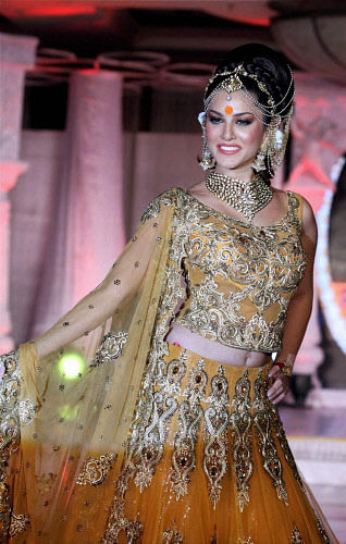 Actress Sunny Leone walks the ramp at a fashion event in Mumbai on Thursday evening. PTI Photo