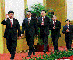 pOLITICAL REFORMS: China's new Politburo Standing Committee members (from L to R) Xi Jinping, Li Keqiang, Zhang Dejiang, Yu Zhengsheng, Liu Yunshan, Wang Qishan and Zhang Gaoli, arrive to meet with the press at the Great Hall of the People in Beijing. REUTERS