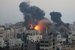 Smoke and explosion are seen after Israeli air strikes in Gaza City November 19, 2012. REUTERS