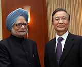 Prime Minister Manmohan Singh shakes hands with Chinese Premier Wen Jiabao during a Bilateral Meeting in Phnom Penh, Cambodia on Monday. PTI