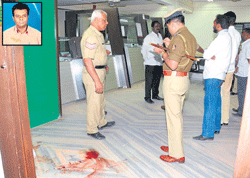 Ghastly: Police officials inspect the spot where Chamundeshwari Petrol bunk manager Murlidhar (inset) was shot at Corporation Bank in Bangalore on Monday. DH photo/ S K Dinesh