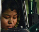 In this photograph taken on September 8, 2012 Rimsha Masih, a Christian girl accused of blasphemy sits in helicopter after her release from jail in Rawalpindi. A Pakistan court on November 20, 2012 threw out all charges against a Christian girl accused of blasphemy in a case that drew international condemnation, lawyers said. Rimsha Masih spent three weeks on remand in an adult jail after she was arrested on August 16 for allegedly burning pages from the Koran in a case that prompted worldwide condemnation. AFP