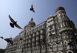 Pigeons fly outside the Taj Mahal Hotel, which was one of the targets of the 26/11 attacks, in Mumbai November 21, 2012. India secretly executed Mohammad Ajmal Kasab, the lone survivor of a Pakistan-based militant squad on Wednesday, just days before the fourth anniversary of an attack that killed 166 people in a rampage through the financial capital of Mumbai. REUTERS