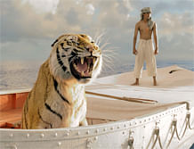 Undated publicity photograph shows Indian actor Sharma playing character Pi, standing near a tiger in a lifeboat, one of props used in film 'Life of Pi' by director Lee Indian actor Suraj Sharma (R) playing the character Pi, stands near a tiger named Richard Parker in a lifeboat, one of the props used in the new film 'Life of Pi' by director Ang Lee, in this undated publicity photograph from the film released to Reuters November 16, 2012. 'Life of Pi' is yet to hit movie theaters, but fans can already buy the film's trusty lifeboat that becomes home to a young Indian boy shipwrecked with a tiger. U.S. online retailer Gilt Groupe said on Friday that the lifeboat, replicated from real rafts used between the 1920s and 1950s, is among props from the movie up for sale next week. Pi's lifeboat is an important character throughout much of the movie and is essentially a film set in itself. REUTERS