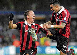 ECSTATIC: AC Milan's Philippe Mexes (left) celebrates with team-mate Kevin-Prince Boateng after scoring against Anderlecht in the Champions League on&#8200;Wednesday. REUTERS