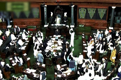 A scene in the Lok Sabha during Parliament's winter session, in New Delhi on Friday . PTI Photo / TV GRAB
