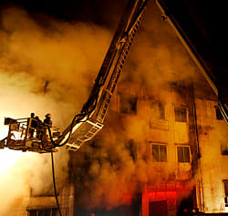 Bangladeshi firefighters battle a fire at a garment factory in the Savar neighborhood in Dhaka, Bangladesh, late Saturday, Nov. 24, 2012. At least 112 people were killed in a fire that raced through the multi-story garment factory just outside of Bangladesh's capital, an official said Sunday. (AP Photo