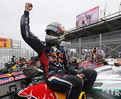 Red Bulls Sebastian Vettel celebrates after emerging the champion at the conclusion of the season-ending Brazilian Grand Prix at Sao Paulo on Sunday. Reuters
