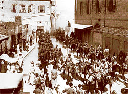 sepia-tinted past Indian cavalry of the Jodhpore and Mysore Lancers, 16th (Imperial Service) Cavalry Brigade passing through Haifa following the city's capture from the Turks. (Photo courtesy: The  Imperial War Museum )