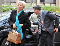 International Monetary Fund (IMF) Managing Director Christine Lagarde (L) arrives on November 26, 2012 prior to an Eurozone meeting at the EU Headquarters in Brussels. Eurozone finance ministers and other creditors of Greece as IMF and ECB meet for the third time in two weeks on immediate funding to avert a threat of bankruptcy for Greece and to deal with the country's ever-growing mountain of debt. AFP PHOTO