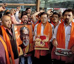 Shiv Sena activists paying respect to the ashes of the late Bal Thackeray. PTI Image