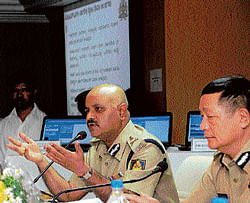 Its easy now: Additional Director General of Police Praveen Sood makes a presentation  on Automatic SMS Gateway facility at the police headquarters in Bangalore on  Tuesday. DH Photo