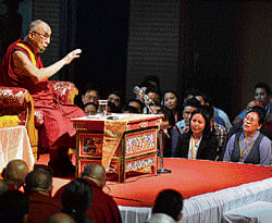 words of peace: The Tibetan spiritual leader, the Dalai Lama, addresses an audience of  Tibetans at a meeting organised by the Central Tibetan Administration (South Zone) in  Bangalore on Tuesday. dh photo