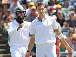 South Africa's Hashim Amla (R) congratulates team mate Dale Steyn after dismissing Australia's Nathan Lyon at the WACA during the first day's play of the third cricket test match in Perth December 1, 2012. REUTERS