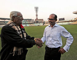 BCCI appointed East Zone Curator Ashish Bhowmick interacts with pitch curator Prabir Mukherjee (L) at Eden Garden in Kolkata on Thursday. BCCI appointed Ashis Bhowmick to prepare the pitch for 3rd Test Match between India and England. PTI