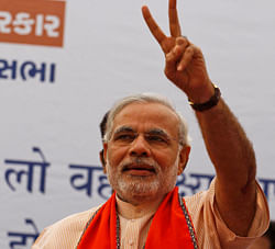 Gujarat state Chief Minister Narendra Modi flashes the victory sign as he arrives for a public meeting before filing his nomination for state assembly elections in Ahmadabad, India, Friday, Nov. 30, 2012. Gujarat state elections are scheduled to be held in December. AP Photo