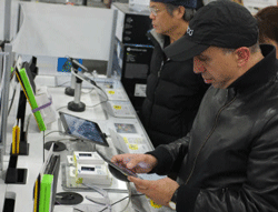 Shoppers look at tablet computers inside of a Best Buy store. AFP