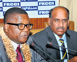 Budding relationship: Kenyan Assistant Minister of Higher Education,  Dr M P Kilemi Mwiria, speaks at the interactive session in Bangalore on Monday. FKCCI president K Shiva Shanmugam is with him. DH photo
