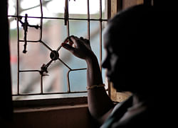 Theresa Kerketa, 45 year old, poses for a picture at her residence on the outskirts of New Delhi November 2, 2012. Kerketa was working as a maid was rescued by Bachpan Bachao Andolan (Save the Childhood Movement), a charity which rescues victims of bonded labour. There are no reliable figures for how many people are trafficked for domestic servitude. The Indian government says 126,321 trafficked children were rescued from domestic work in 2011/12, a rise of almost 27 percent from the previous year. Activists say if you include women over 18 years, the figure could run into the hundreds of thousands. Picture taken November 2, 2012.REUTERS